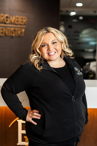 Abby Insurance Coordinator at Burgmeier Dentistry in Mason City smiling in her black uniform