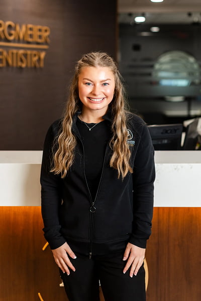 Emily Dental Assistant at Burgmeier Dentistry in Mason City smiling in her black uniform
