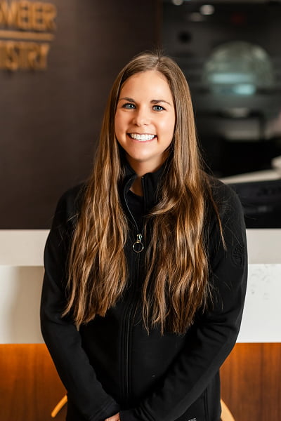 Heather Dental Hygienist at Burgmeier Dentistry in Mason City smiling in her black uniform