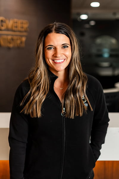 Jena Dental Assistant at Burgmeier Dentistry in Mason City smiling in her black uniform