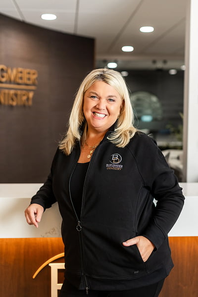 Nancy Office Manager at Burgmeier Dentistry in Mason City smiling in her black uniform