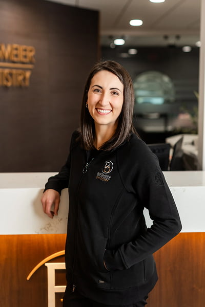 Natasha Dental Assistant at Burgmeier Dentistry in Mason City smiling in her black uniform