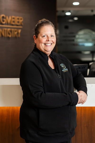 Tasha Dental Hygienist at Burgmeier Dentistry in Mason City smiling in her black uniform