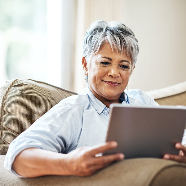A woman looking at a tablet