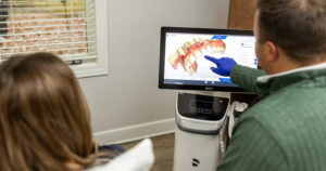 A doctor pointing at a 3D scan