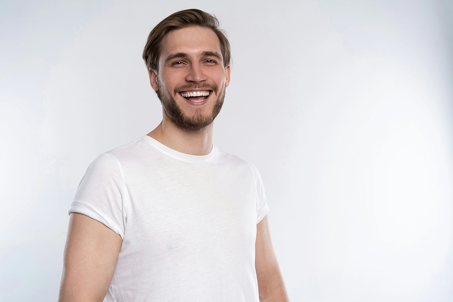 A midlife man wearing a white shirt