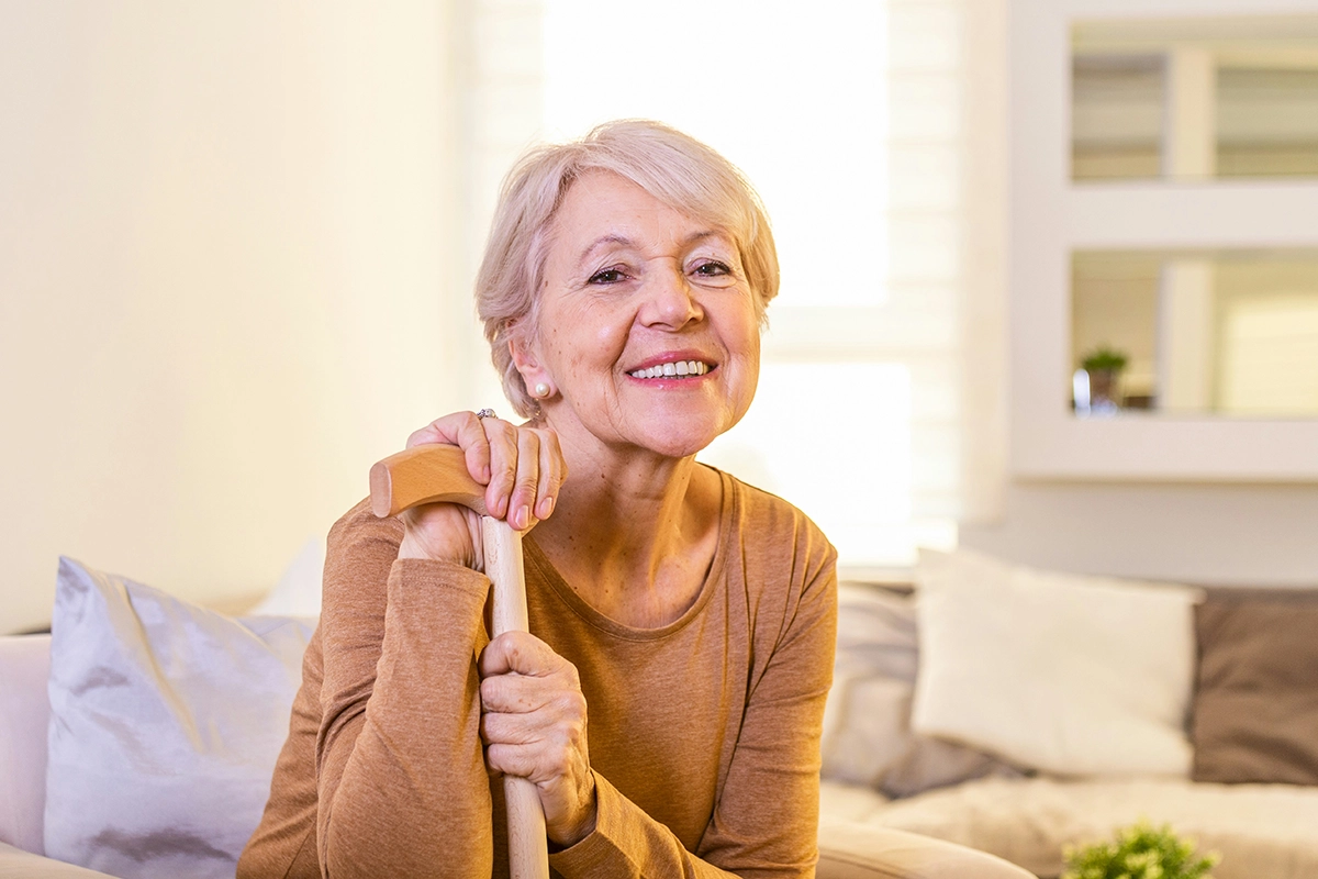An older woman with a cane